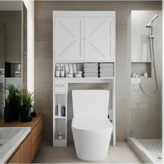 Bathroom setup with white farmhouse cabinet placed above toilet