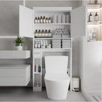 Over-the-toilet storage cabinet with doors open, shelves organized with towels